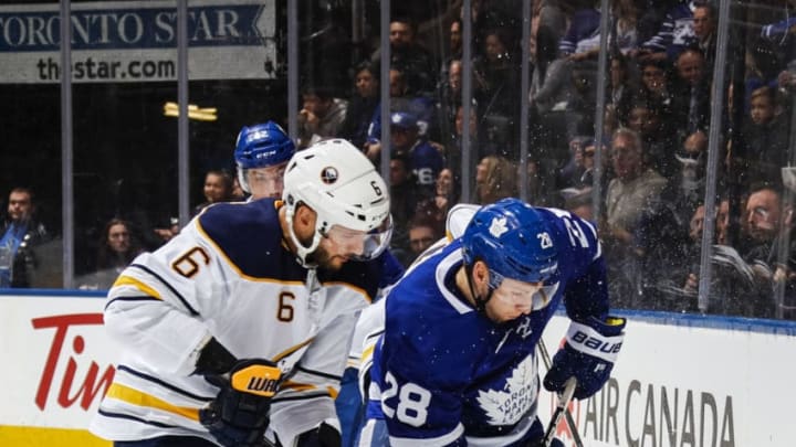 TORONTO, ON - MARCH 26: Connor Brown #28 of the Toronto Maple Leafs skates against Marco Scandella #6 of the Buffalo Sabres during the first period at the Air Canada Centre on March 26, 2018 in Toronto, Ontario, Canada. (Photo by Mark Blinch/NHLI via Getty Images)