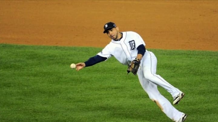 Oct 17, 2013; Detroit, MI, USA; Detroit Tigers second baseman Omar Infante (4) throws to first base against the Boston Red Sox in game five of the American League Championship Series baseball game at Comerica Park. Mandatory Credit: Tim Fuller-USA TODAY Sports