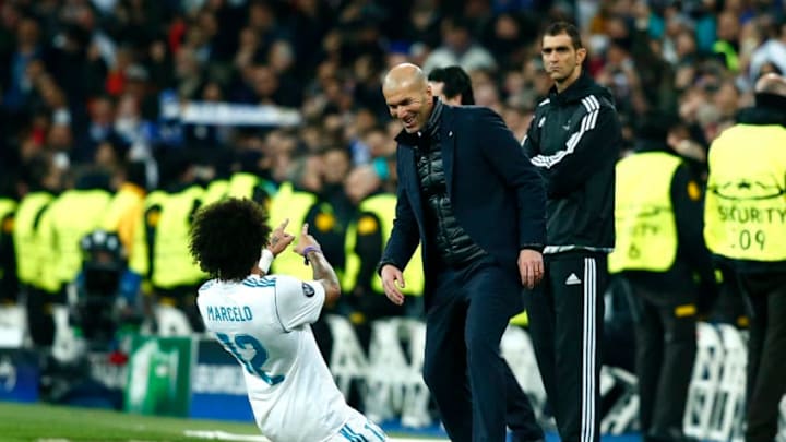 MADRID, SPAIN - FEBRUARY 14: Marcelo of Real Madrid celebrates scoring the 3rd Real Madrid goal with Zinedine Zidane of Real Madrid during the UEFA Champions League Round of 16 First Leg match between Real Madrid and Paris Saint-Germain at Bernabeu on February 14, 2018 in Madrid, Spain. (Photo by Gonzalo Arroyo Moreno/Getty Images)