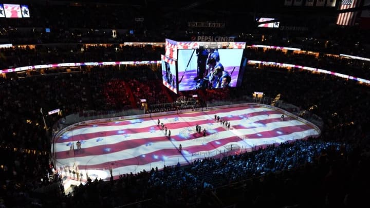Apr 9, 2016; Denver, CO, USA; General wide view of the American flag projected onto the rink of the Pepsi Center before the start of the game between the Anaheim Ducks against the Colorado Avalanche. Mandatory Credit: Ron Chenoy-USA TODAY Sports
