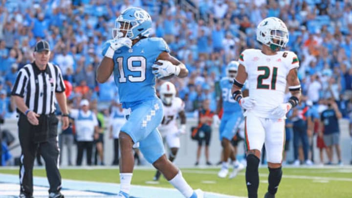 CHAPEL HILL, NORTH CAROLINA – OCTOBER 16: Ty Chandler #19 of the North Carolina Tar Heels scores a touchdown against the Miami Hurricanes during their game at Kenan Memorial Stadium on October 16, 2021 in Chapel Hill, North Carolina. North Carolina won 45-42. (Photo by Grant Halverson/Getty Images)