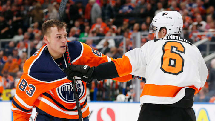 Oct 16, 2019; Edmonton, Alberta, CAN; Edmonton Oilers defensemen Matt Benning (83) and Philadelphia Flyers defensemen Travis Sanheim (6) scuffle after a whistle during the third period at Rogers Place. Mandatory Credit: Perry Nelson-USA TODAY Sports