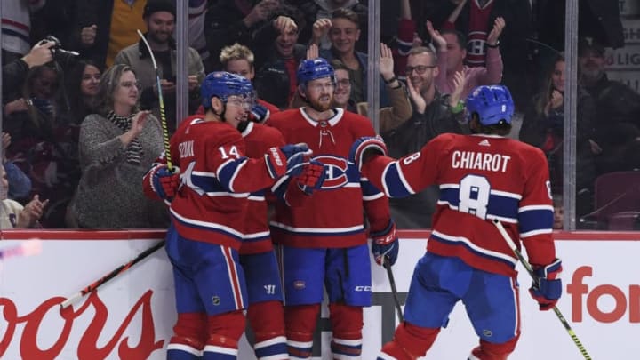 MONTREAL, QC - OCTOBER 26: Nick Suzuki #14 of the Montreal Canadiens celebrates with teammates after scoring a goal against the Toronto Maple Leafs in the NHL game at the Bell Centre on October 26, 2019 in Montreal, Quebec, Canada. (Photo by Francois Lacasse/NHLI via Getty Images)