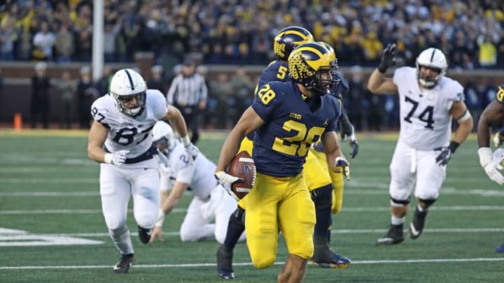 ANN ARBOR, MI - NOVEMBER 03: Brandon Watson #28 of the Michigan Wolverines returns 62 yards for a third quarter touchdown during the game against the Penn State Nittany Lions at Michigan Stadium on November 3, 2018 in Ann Arbor, Michigan. Michigan defeated Penn State 42-7. (Photo by Leon Halip/Getty Images)