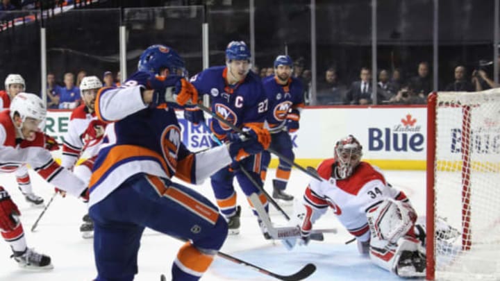 NEW YORK, NEW YORK – APRIL 26: Petr Mrazek #34 of the Carolina Hurricanes stops Brock Nelson #29 of the New York Islanders on the second period powerplay in Game One of the Eastern Conference Second Round during the 2019 NHL Stanley Cup Playoffs at the Barclays Center on April 26, 2019 in the Brooklyn borough of New York City. (Photo by Bruce Bennett/Getty Images)