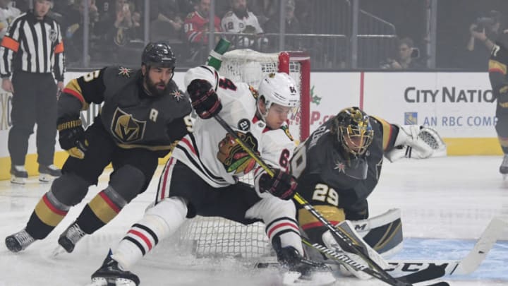 LAS VEGAS, NEVADA - DECEMBER 06: Marc-Andre Fleury #29 of the Vegas Golden Knights blocks a shot by David Kampf #64 of the Chicago Blackhawks as Deryk Engelland #5 of the Golden Knights defends in the first period of their game at T-Mobile Arena on December 6, 2018 in Las Vegas, Nevada. (Photo by Ethan Miller/Getty Images)