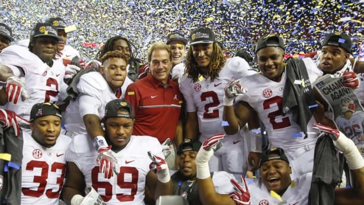 Dec 3, 2016; Atlanta, GA, USA; Alabama Crimson Tide head coach Nick Saban celebrates winning the trophy with his team after the SEC Championship college football game against the Florida Gators at Georgia Dome. Alabama defeated Florida 54-16. Mandatory Credit: Jason Getz-USA TODAY Sports