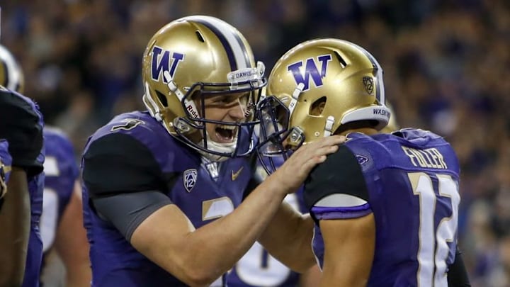 Sep 30, 2016; Seattle, WA, USA; Washington Huskies quarterback Jake Browning (3) celebrates with wide receiver Aaron Fuller (12) after a three-yard touchdown pass from Browning to Fuller during the second half at Husky Stadium. Washington won 44-6. Mandatory Credit: Jennifer Buchanan-USA TODAY Sports