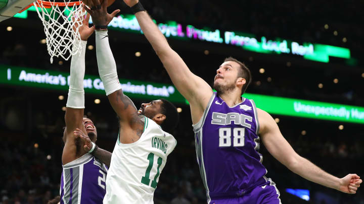 BOSTON, MASSACHUSETTS – MARCH 14: Nemanja Bjelica #88 of the Sacramento Kings blocks a shot from Kyrie Irving #11 of the Boston Celtics during the second half at TD Garden on March 14, 2019 in Boston, Massachusetts. The Celtics defeat the Kings 126-120. (Photo by Maddie Meyer/Getty Images)