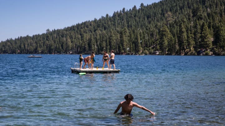 SOUTH LAKE TAHOE, CA - AUGUST 9: Kids enjoy a sunny day at Fallen Leaf Lake, located adjacent to Lake Tahoe near Emerald Bay, on August 9, 2020, in South Lake Tahoe, California. Lake Tahoe has proven to be a major destination this summer for Covid-19 weary tourists hoping to trade the pandemic for the clean air, camping, and water sports found at this Sierra Nevada Mountain Range high altitude lake. (Photo by George Rose/Getty Images)