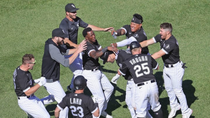 CHICAGO, ILLINOIS - JUNE 16: Yasmani Grandal #24 of the Chicago White Sox (center) is mobbed by teammates after geting the game-winning hit, a run scoring single in the 10th inning, against the Tampa Bay Rays at Guaranteed Rate Field on June 16, 2021 in Chicago, Illinois. The White Sox defeated the Rays 8-7 in 10 innings. (Photo by Jonathan Daniel/Getty Images)