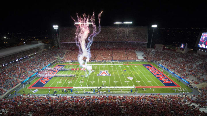 TUCSON, AZ - SEPTEMBER 13: The Arizona Wildcats take the field with fireworks to start the game against the Nevada Wolf Pack at Arizona Stadium on September 13, 2014 in Tucson, Arizona. (Photo by Paul Dye/J and L Photography/Getty Images )
