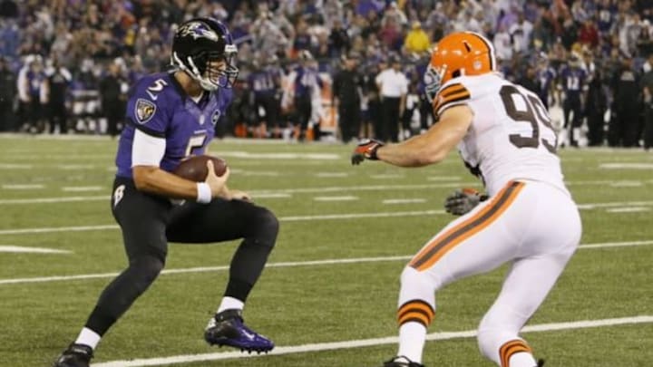 September 27, 2012; Baltimore, MD, USA; Baltimore Ravens quarterback Joe Flacco (5) runs for a touchdown in front of Cleveland Browns linebacker Scott Fujita (99) at M&T Bank Stadium. Mandatory Credit: Mitch Stringer-USA TODAY Sports