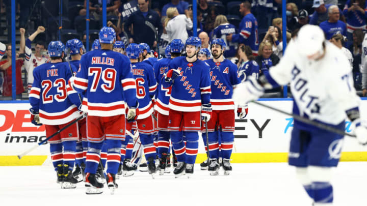 Mar 19, 2022; Tampa, Florida, USA;New York Rangers defenseman Jacob Trouba (8) and teammates celebrate as they beat the Tampa Bay Lightning at Amalie Arena. Mandatory Credit: Kim Klement-USA TODAY Sports