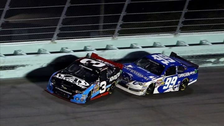 Nov 16, 2013; Homestead, FL, USA; NASCAR Nationwide Series driver Austin Dillon (3) gets turned by Blake Koch (99) during the Ford EcoBoost 300 at Homestead-Miami Speedway. Mandatory Credit: Jerry Lai-USA TODAY Sports
