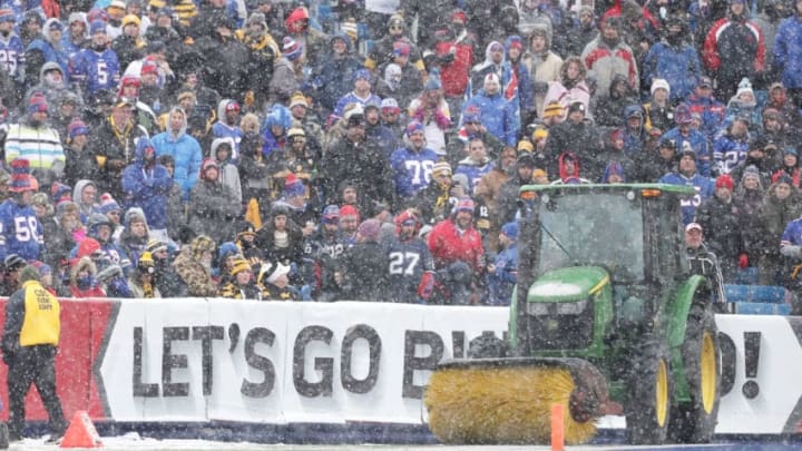 ORCHARD PARK, NY - DECEMBER 11: Maintenence crews repair the field due to inclement weather at halftime of the game between the Buffalo Bills and Pittsburgh Steelers at New Era Field on December 11, 2016 in Orchard Park, New York. (Photo by Brett Carlsen/Getty Images)