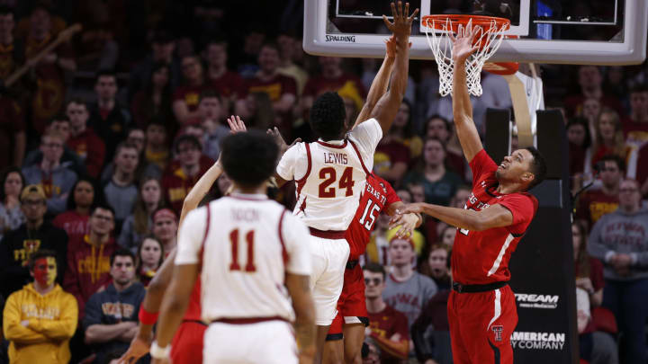 Terrence Lewis #24 of the Iowa State Cyclones takes a shot as TJ Holyfield #22 of the Texas Tech Red Raiders blocks. (Photo by David Purdy/Getty Images)