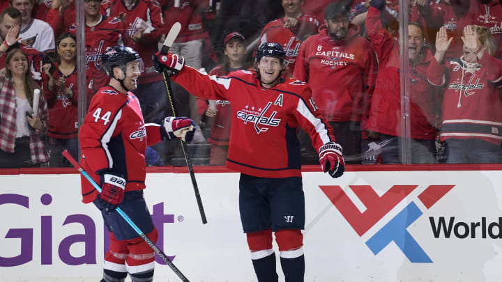 WASHINGTON, DC – APRIL 13: Nicklas Backstrom #19 of the Washington Capitals celebrates with Brooks Orpik #44 and Alex Ovechkin #8 after scoring a goal in the first period against the Carolina Hurricanes in Game Two of the Eastern Conference First Round during the 2019 NHL Stanley Cup Playoffs at Capital One Arena on April 13, 2019 in Washington, DC. (Photo by Patrick McDermott/NHLI via Getty Images)
