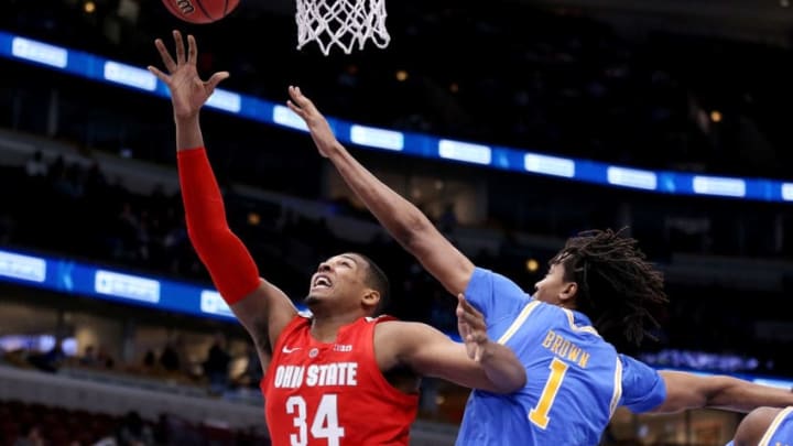 CHICAGO, ILLINOIS - DECEMBER 22: Kaleb Wesson #34 of the Ohio State Buckeyes attempts a shot while being guarded by Moses Brown #1 of the UCLA Bruins in the first half during the CBS Sports Classic at the United Center on December 22, 2018 in Chicago, Illinois. (Photo by Dylan Buell/Getty Images)