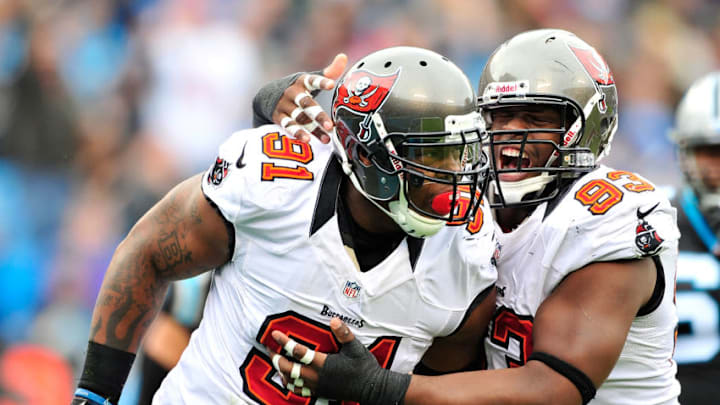 CHARLOTTE, NC - NOVEMBER 18: Da'Quan Bowers #91 and Gerald McCoy #93 of the Tampa Bay Buccaneers celebrate after Bowers' sack of quarterback Cam Newton #1 of the Carolina Panthers during play at Bank of America Stadium on November 18, 2012 in Charlotte, North Carolina. (Photo by Grant Halverson/Getty Images)