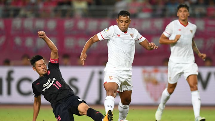 OSAKA, JAPAN - JULY 17: Luis Muriel of Sevilla FC (R) is tackled by Hotaru Yamaguchi of Cerezo Osaka (L) during the preseason friendly match between Cerezo Osaka and Sevilla FC at Yanmar Stadium Nagai on July 17, 2017 in Osaka, Japan. (Photo by Atsushi Tomura/Getty Images)