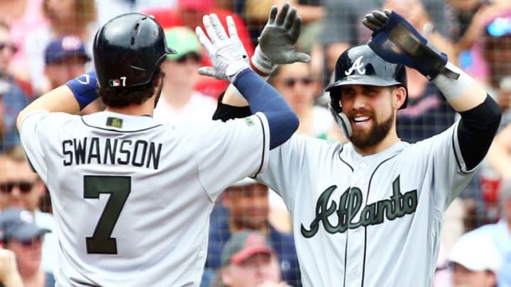 BOSTON, MA - MAY 26: Dansby Swanson #7 high fives Ender Inciarte #11 of the Atlanta Braves after hitting a two-run home run in the second inning of a game against the Boston Red Sox at Fenway Park on May 26, 2018 in Boston, Massachusetts. (Photo by Adam Glanzman/Getty Images)