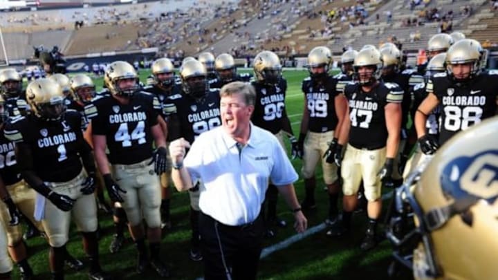 Sep 7, 2013; Boulder, CO, USA; Colorado Buffaloes head coach Mike Macintyre huddles with members of his team before the game against the Central Arkansas Bears at Folsom Field. Mandatory Credit: Ron Chenoy-USA TODAY Sports