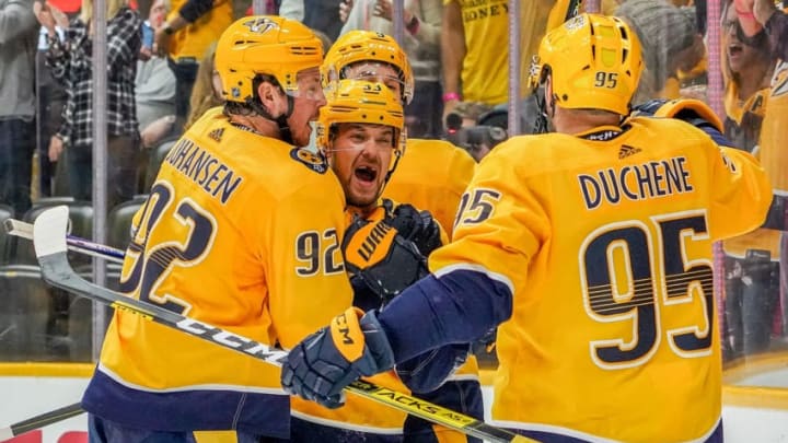 NASHVILLE, TN - OCTOBER 5: Viktor Arvidsson #33 celebrates his goal with Ryan Johansen #92, Ryan Johansen #92 and Filip Forsberg #9 of the Nashville Predators against the Detroit Red Wings at Bridgestone Arena on October 5, 2019 in Nashville, Tennessee. (Photo by John Russell/NHLI via Getty Images)