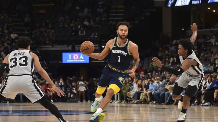 Dec 31, 2021; Memphis, Tennessee, USA; Memphis Grizzlies forward Kyle Anderson (1) dribbles the ball against San Antonio Spurs guard Tre Jones (33) during the second half at FedExForum. Mandatory Credit: Justin Ford-USA TODAY Sports