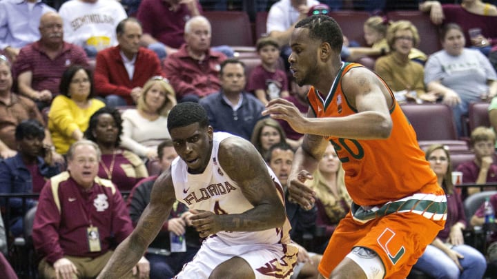 Mar 4, 2017; Tallahassee, FL, USA; Florida State Seminoles guard Dwayne Bacon (4) drives to the hoop against Miami Hurricane forward Dewan Huell (20) during the second half at Donald L. Tucker Center. Florida State won 64-57. Mandatory Credit: Glenn Beil-USA TODAY Sports