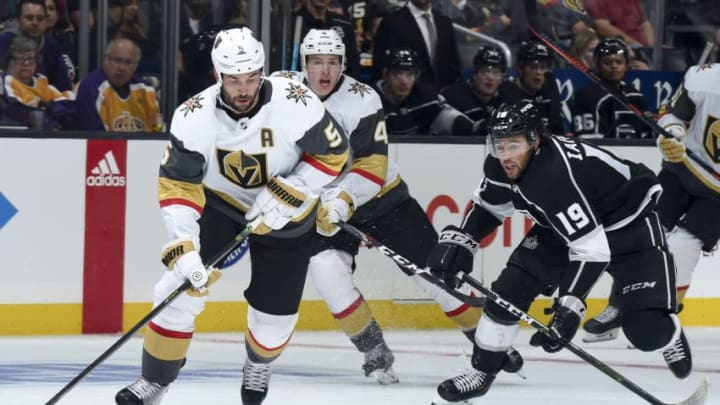LOS ANGELES, CA - SEPTEMBER 19: Deryk Engelland #5 of the Vegas Golden Knights and Alex Iafallo #19 of the Los Angeles Kings race for the puck during the third period of the preseason game at STAPLES Center on September 19, 2019 in Los Angeles, California. (Photo by Juan Ocampo/NHLI via Getty Images)