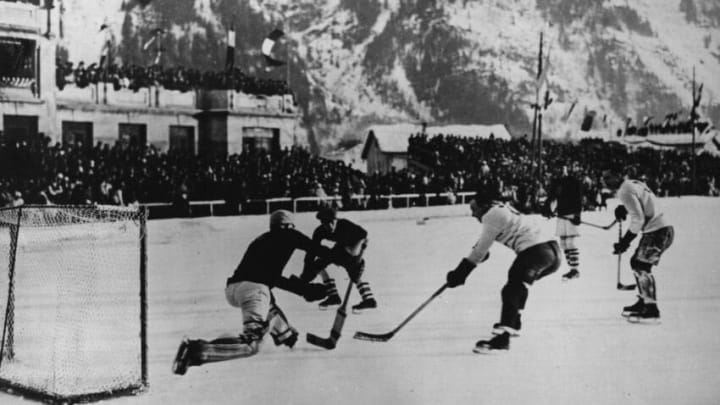 1924: National teams from Canada and the USA in action during an ice hockey match at the Winter Olympic Games at Chamonix. (Photo by Topical Press Agency/Getty Images)