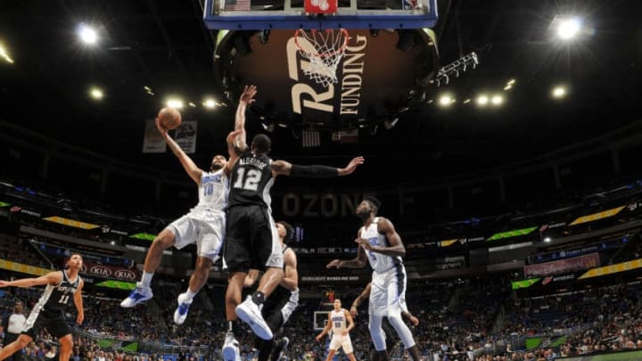 ORLANDO, FL - DECEMBER 19: Evan Fournier #10 of the Orlando Magic shoots the ball against the San Antonio Spurs on December 19, 2018 at Amway Center in Orlando, Florida. NOTE TO USER: User expressly acknowledges and agrees that, by downloading and or using this photograph, User is consenting to the terms and conditions of the Getty Images License Agreement. Mandatory Copyright Notice: Copyright 2018 NBAE (Photo by Fernando Medina/NBAE via Getty Images)