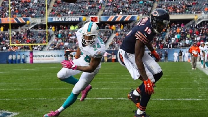 Oct 19, 2014; Chicago, IL, USA; Chicago Bears wide receiver Brandon Marshall (15) attempts to make a catch against Miami Dolphins cornerback Cortland Finnegan (24) during the second half at Soldier Field. Miami Dolphins defeat the Chicago Bears 27-14. Mandatory Credit: Mike DiNovo-USA TODAY Sports Oct 19, 2014; Chicago, IL, USA; Chicago Bears wide receiver Brandon Marshall (15) attempts to make a catch against Miami Dolphins cornerback Cortland Finnegan (24) during the second half at Soldier Field. Miami Dolphins defeat the Chicago Bears 27-14. Mandatory Credit: Mike DiNovo-USA TODAY Sports