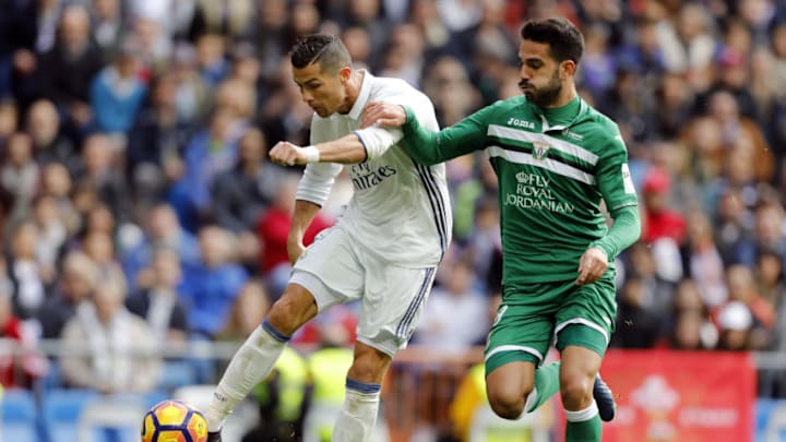 MADRID, SPAIN - NOVEMBER 06: Cristiano Ronaldo of Real Madrid shoots on goal under pressure from Pablo Insua of Leganes during the La Liga match between Real Madrid CF and Leganes at Estadio Santiago Bernabeu on November 6, 2016 in Madrid, Spain. (Photo by Angel Martinez/Real Madrid via Getty Images)
