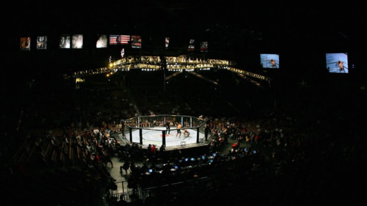 Las Vegas, UNITED STATES: This overall photo shows a fight between Brazilian Lyoto Machida and Sam 'The Alaskan Assassin' Hoger of the US during their UFC 67: All or Nothing fight at the Mandalay Bay Hotel in Las Vegas, Nevada 04 February 2007. Started in 1993, the Ultimate Fighting Competition (UFC) is a combination of martial arts and boxing. Dana White, President of the UFC is looking to expand the sport to Europe and Japan. Hoger defeated Machida. AFP PHOTO/GABRIEL BOUYS (Photo credit should read GABRIEL BOUYS/AFP/Getty Images)