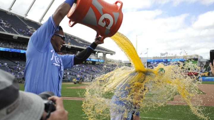 KANSAS CITY, MO - MAY 3: Salvador Perez #13 of the Kansas City Royals douses Alex Gordon #4 with Gatorade as they celebrate a 10-6 win over the Detroit Tigers at Kauffman Stadium on May 3, 2018 in Kansas City, Missouri. (Photo by Ed Zurga/Getty Images)