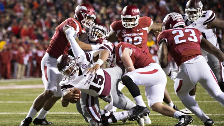 FAYETTEVILLE, AR – NOVEMBER 21: Dak Prescott #15 of the Mississippi State Bulldogs dives into the end zone for a touchdown during a game against the Arkansas Razorbacks at Razorback Stadium Stadium on November 21, 2015 in Fayetteville, Arkansas. The Bulldogs defeated the Razorbacks 51-50. (Photo by Wesley Hitt/Getty Images)