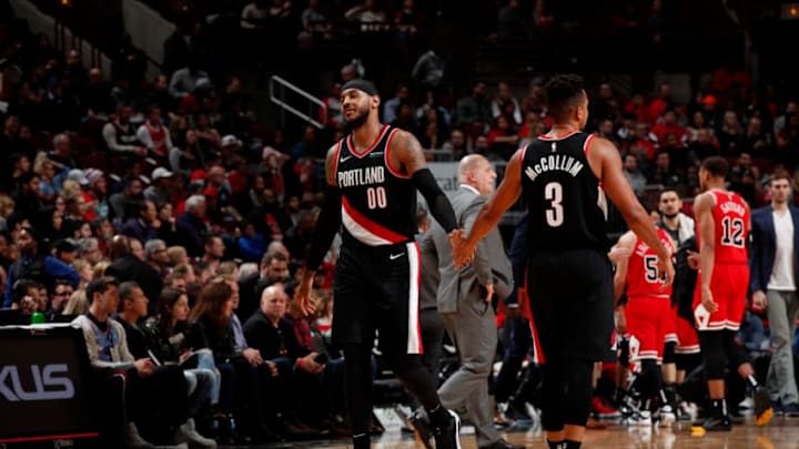 CHICAGO, IL - NOVEMBER 25: Carmelo Anthony #00, and CJ McCollum #3 of the Portland Trail Blazers hi-five each other against the Chicago Bulls on November 25, 2019 at United Center in Chicago, Illinois. NOTE TO USER: User expressly acknowledges and agrees that, by downloading and or using this photograph, User is consenting to the terms and conditions of the Getty Images License Agreement. Mandatory Copyright Notice: Copyright 2019 NBAE (Photo by Jeff Haynes/NBAE via Getty Images)