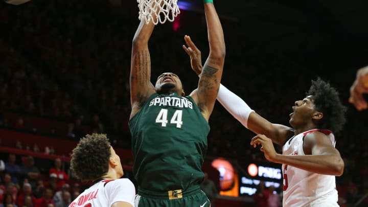 PISCATAWAY, NJ – NOVEMBER 30: Nick Ward #44 of the Michigan State Spartans attempts a shot as Caleb McConnell #22 and Eugene Omoruyi #5 of the Rutgers Scarlet Knights defend during the first half of a college basketball game at the Rutgers Athletic Center on November 30, 2018 in Piscataway, New Jersey. Michigan State defeated Rutgers 78-67. (Photo by Rich Schultz/Getty Images,)