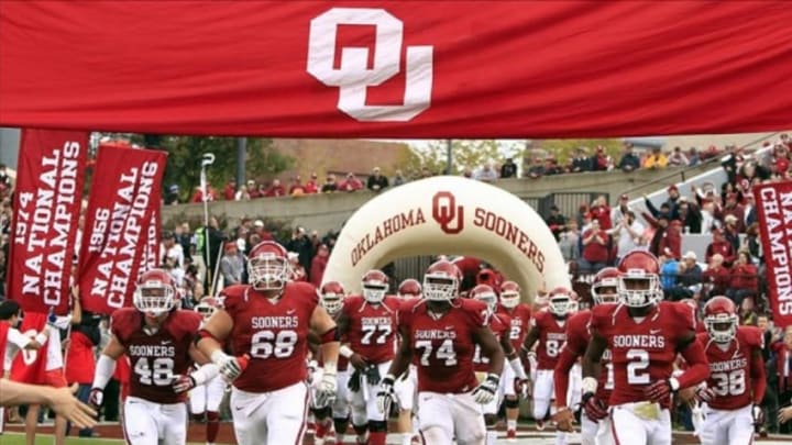 Oct 26, 2013; Norman, OK, USA; The Oklahoma Sooners run onto the field before the start of a game against the Texas Tech Red Raiders at Gaylord Family-Oklahoma Memorial Stadium. Mandatory Credit: Alonzo Adams-USA TODAY Sports