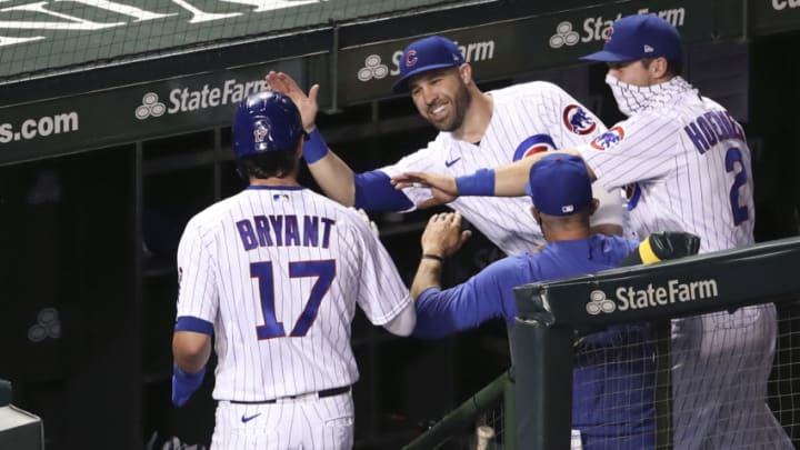 Sep 15, 2020; Chicago, Illinois, USA; Chicago Cubs third baseman Kris Bryant (17) celebrates with teammates after scoring against the Cleveland Indians during the fifth inning at Wrigley Field. Mandatory Credit: Kamil Krzaczynski-USA TODAY Sports
