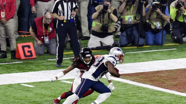 HOUSTON, TX – FEBRUARY 05: James White #28 of the New England Patriots scores getting past Jalen Collins #32 of the Atlanta Falcons during Super Bowl 51 at NRG Stadium on February 5, 2017 in Houston, Texas. The Patriots defeat the Atlanta Falcons 34-28 in overtime. (Photo by Focus on Sport/Getty Images)