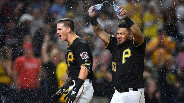 PITTSBURGH, PA - SEPTEMBER 27: Kevin Newman #27 of the Pittsburgh Pirates celebrates his two run home run with Melky Cabrera #53 during the ninth inning against the Cincinnati Reds at PNC Park on September 27, 2019 in Pittsburgh, Pennsylvania. (Photo by Joe Sargent/Getty Images)
