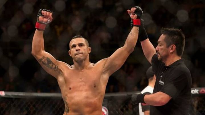 Nov 7, 2015; Sao Paulo, Brazil; Vitor Belfort (red gloves) reacts after defeating Dan Henderson (blue gloves) during UFC Fight Night at Ibirapuera Gymnasium. Mandatory Credit: Jason Silva-USA TODAY Sports