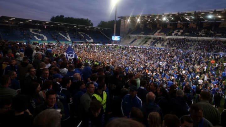 SV Darmstadt 98 fans celebrate after their team won promotion to the German top flight. (Photo by Alex Grimm/Getty Images)