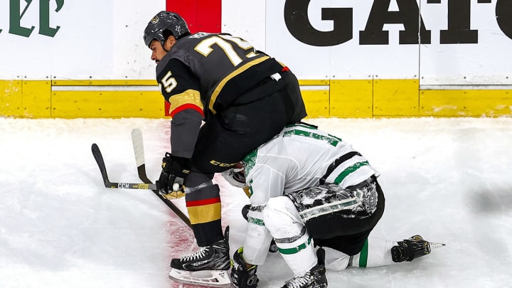 Ryan Reaves #75 of the Vegas Golden Knights scuffles with Blake Comeau #15 of the Dallas Stars after checking him during the first period in Game Five