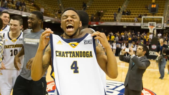 Mar 7, 2016; Asheville, NC, USA; Chattanooga Mocs guard Johnathan Burroughs-Cook (4) celebrates after defeating the East Tennessee State Buccaneers in the Southern Conference tournament final at the U.S. Cellular Center. Chattanooga defeated East Tennessee State 73-67. Mandatory Credit: Jeremy Brevard-USA TODAY Sports