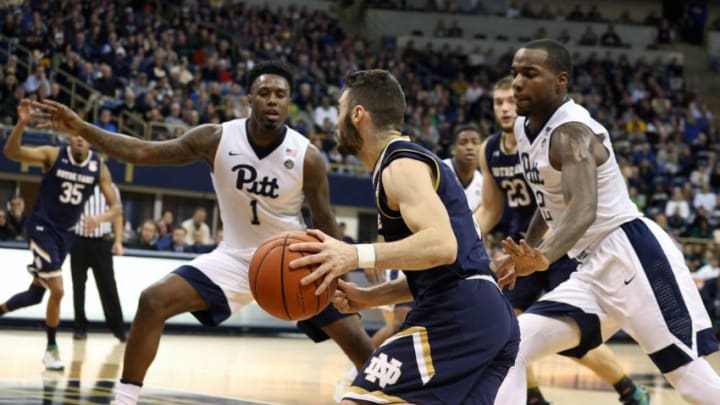 Dec 31, 2016; Pittsburgh, PA, USA; Notre Dame Fighting Irish guard Matt Farrell (middle) drives to the basket against Pittsburgh Panthers forward Jamel Artis (1) and forward Michael Young (2) during the first half at the Petersen Events Center. Mandatory Credit: Charles LeClaire-USA TODAY Sports