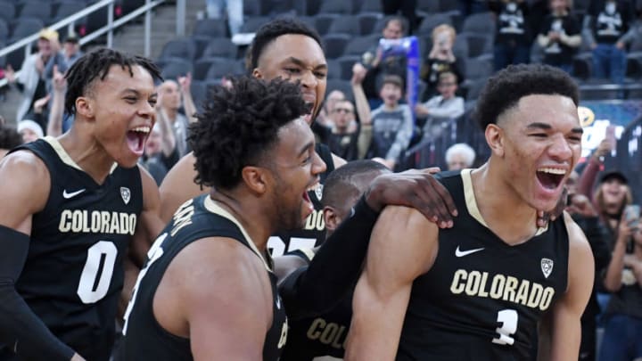 LAS VEGAS, NEVADA - NOVEMBER 26: Tyler Bey (R) #1 of the Colorado Buffaloes is mobbed by teammates as he is announced as the tournament MVP after the team's 71-67 victory over the Clemson Tigers to win the MGM Resorts Main Event basketball tournament at T-Mobile Arena on November 26, 2019 in Las Vegas, Nevada. (Photo by Ethan Miller/Getty Images)